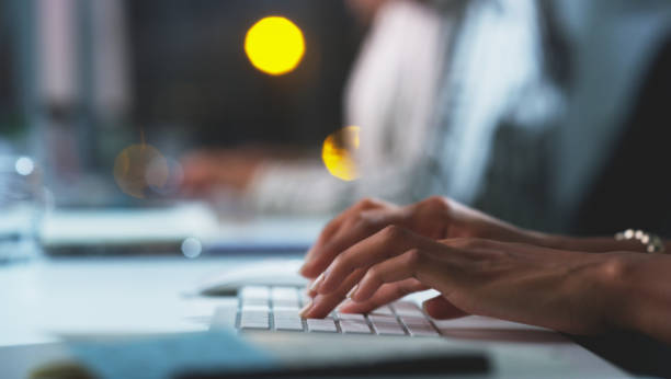 Keyboard used by businesswoman suggesting digital evolution and speed of scale