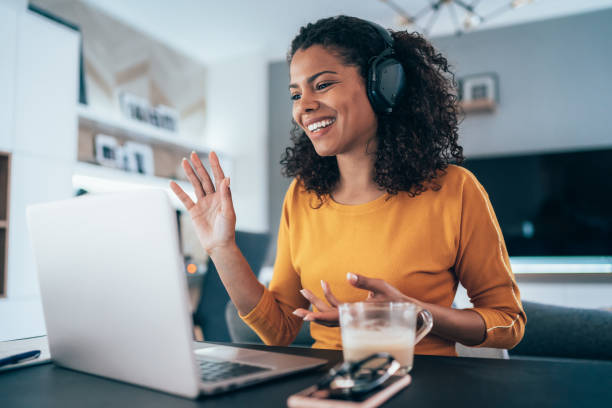A woman enjoying a video conference supported by reliable and efficient connectivity and security services